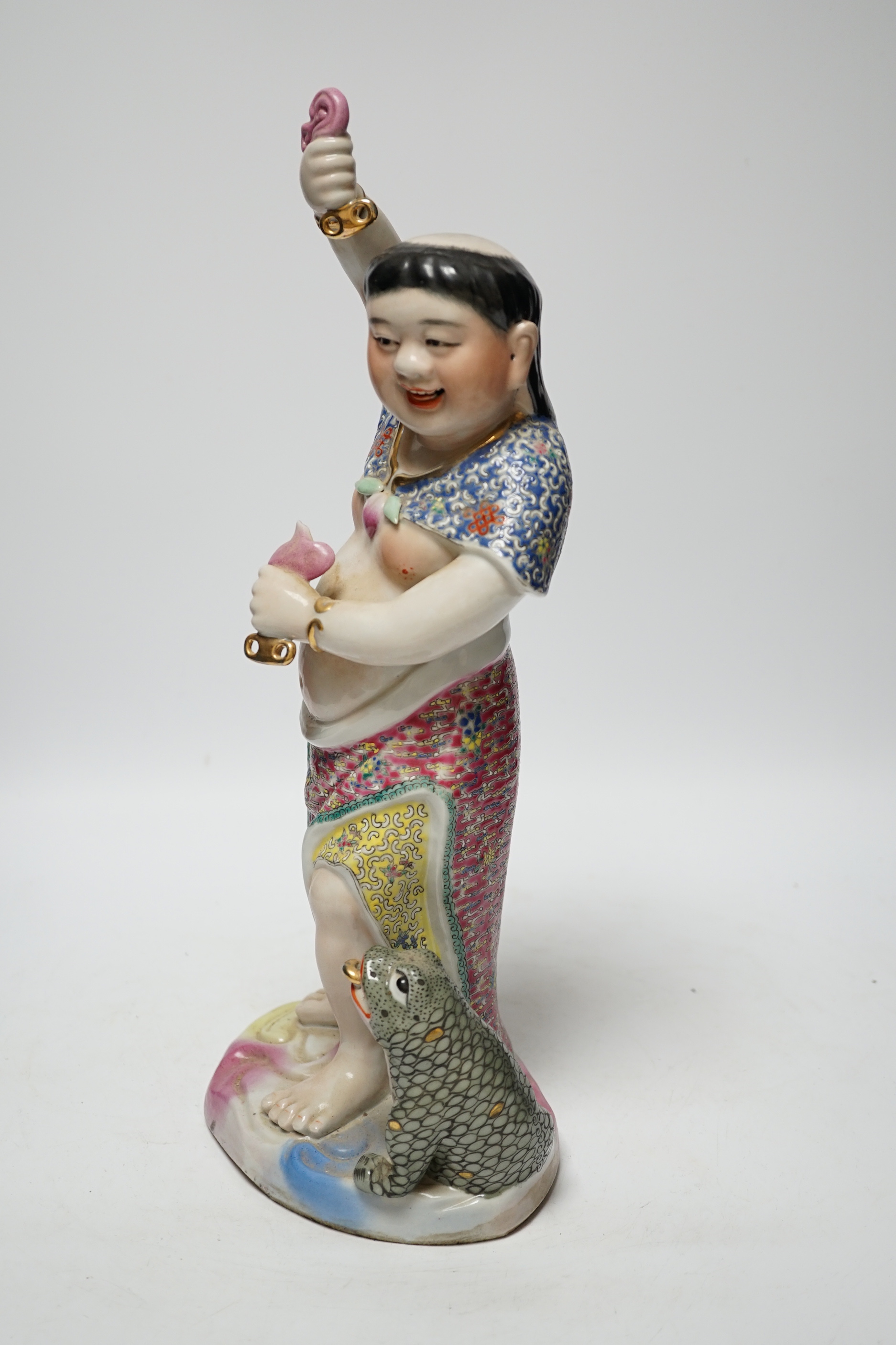 A Chinese famille rose porcelain figure of Liu Hai, stamp to base, 39cm